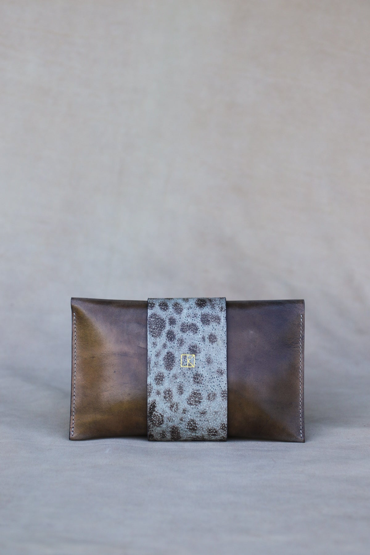 Italian leather and wolffish clutch