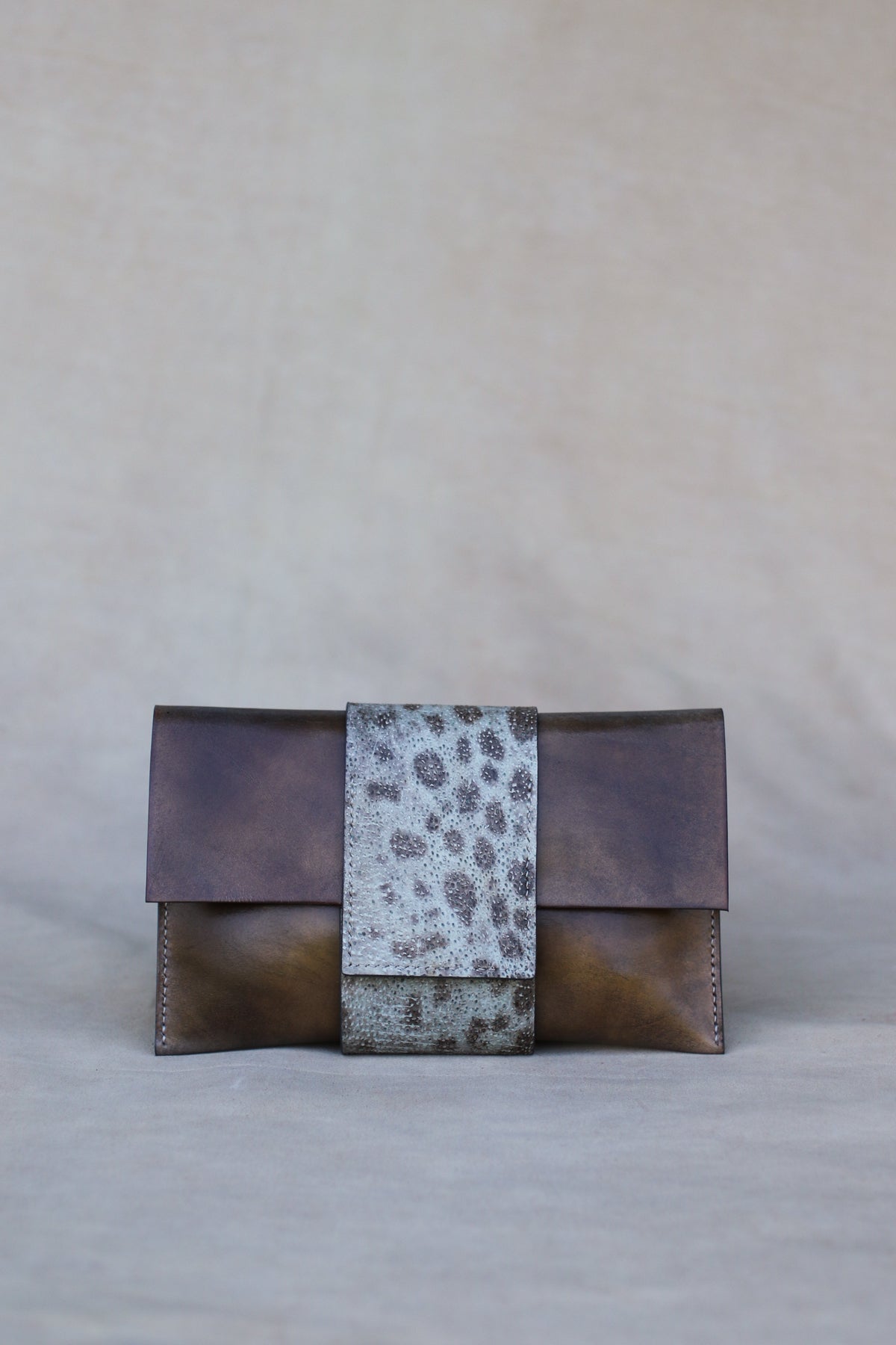 Italian leather and wolffish clutch