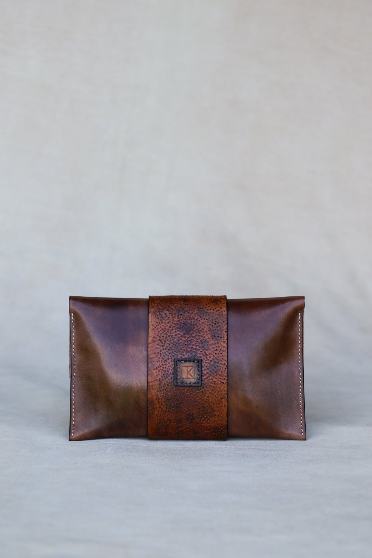 Brown Italian leather and wolffish clutch