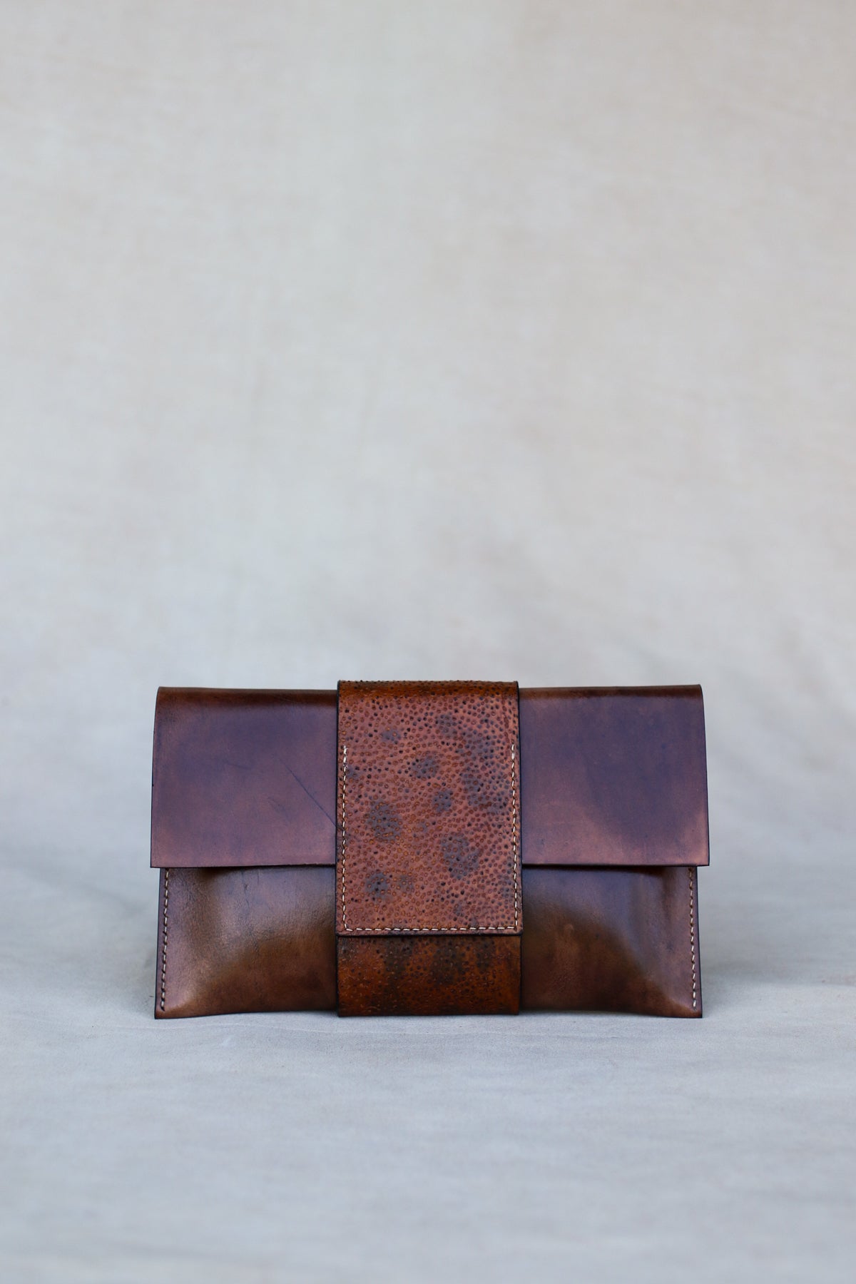 Brown Italian leather and wolffish clutch