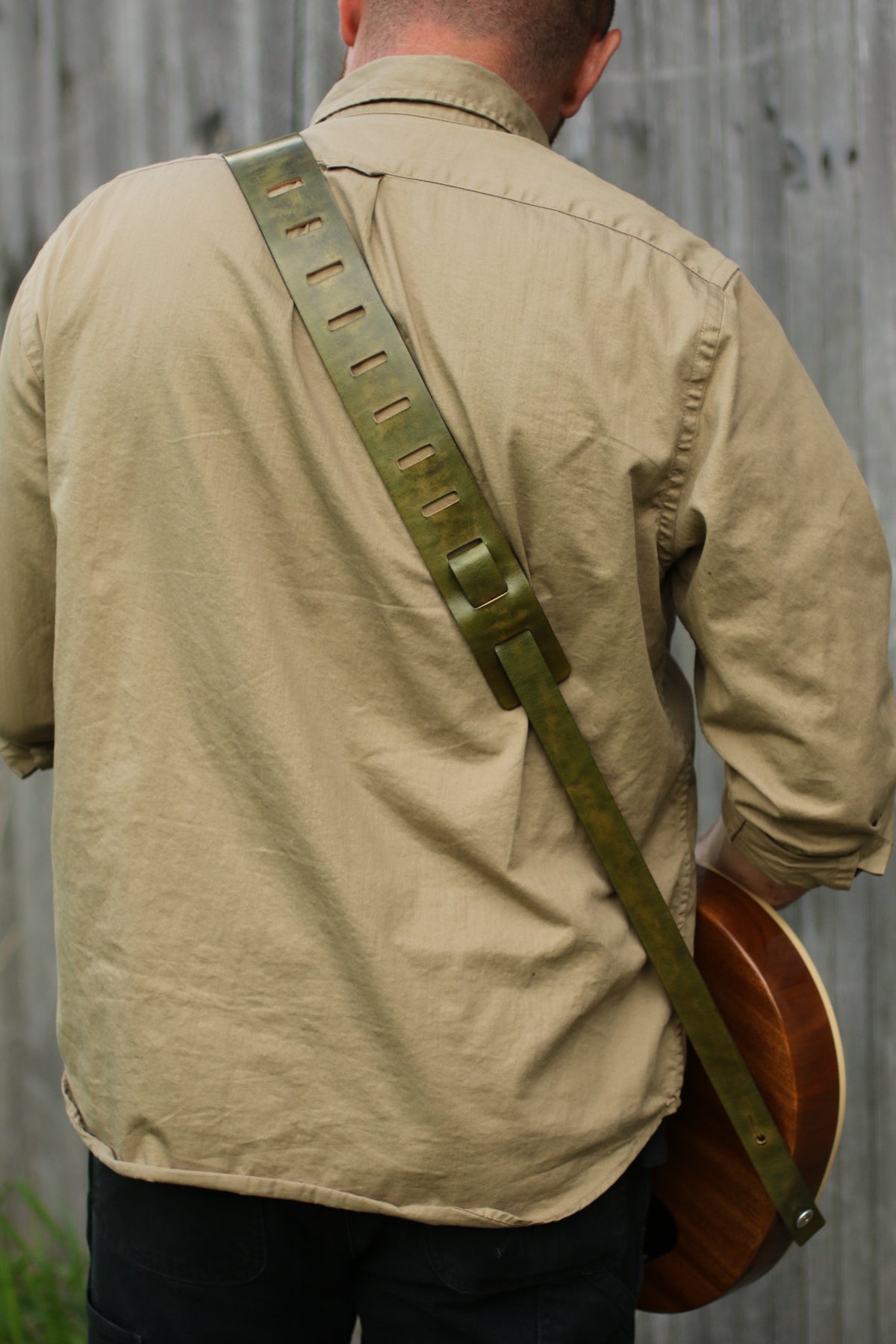 green leather narrow guitar strap