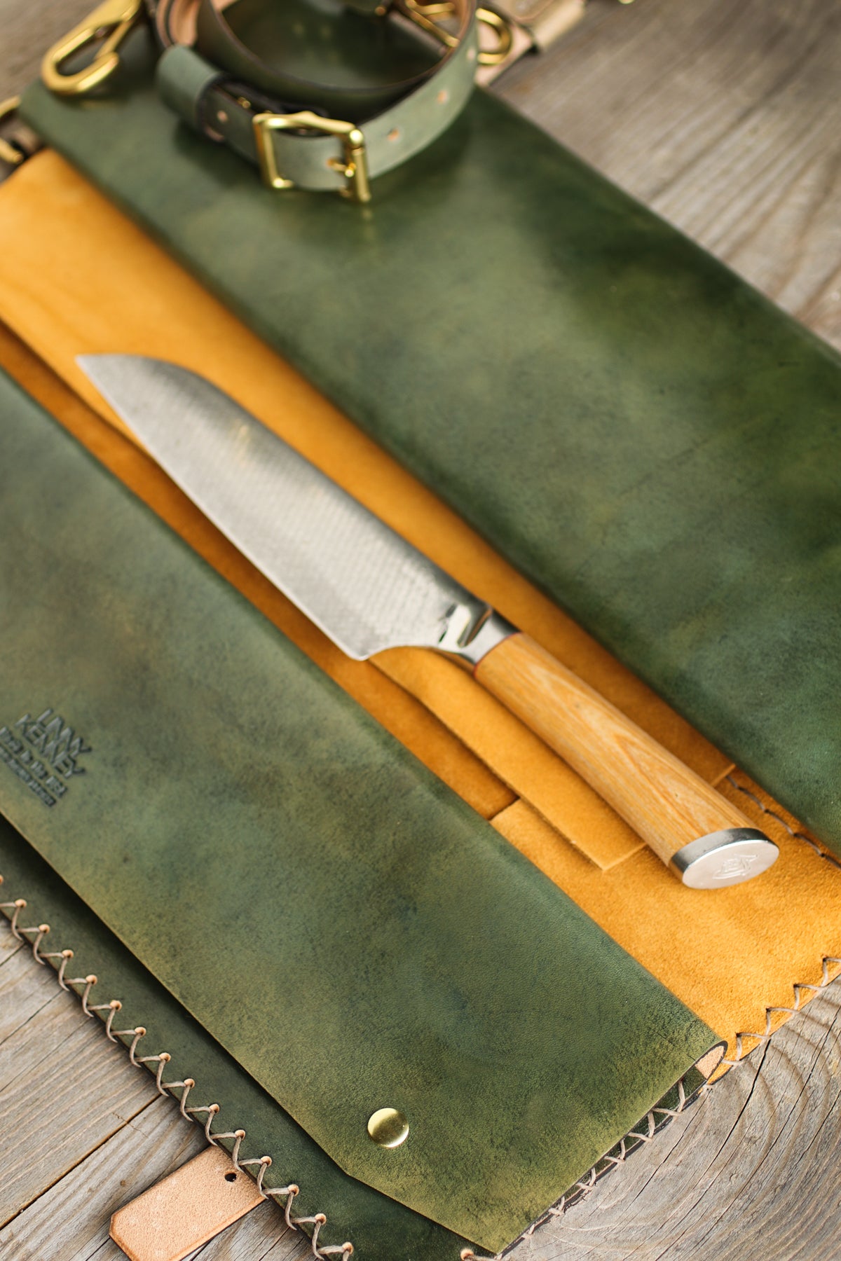 green and gold leather knife roll