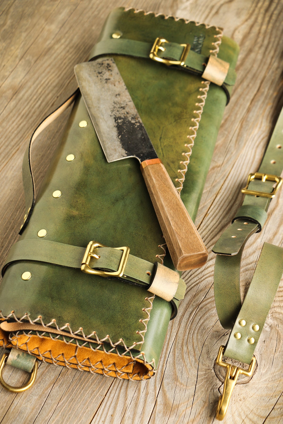 green and gold leather knife roll