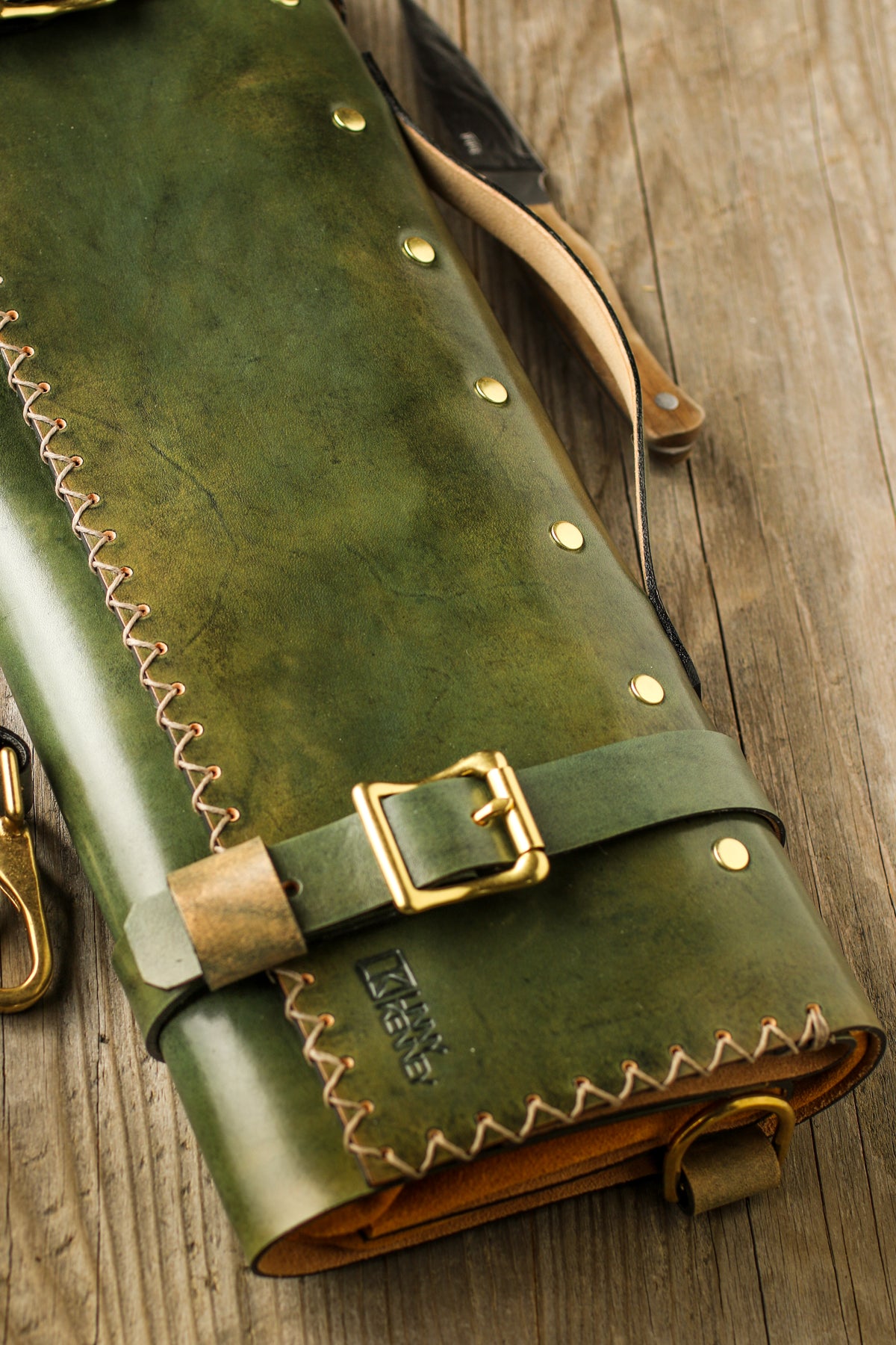 green and gold leather knife roll