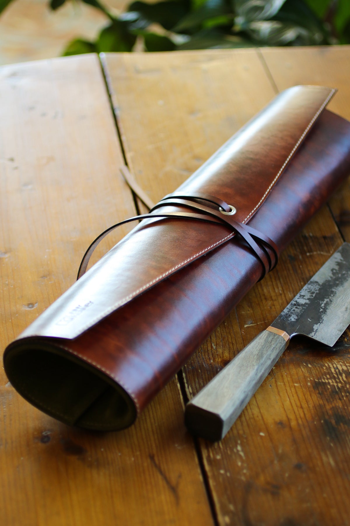 green-and-burgandy-leather-knife-roll