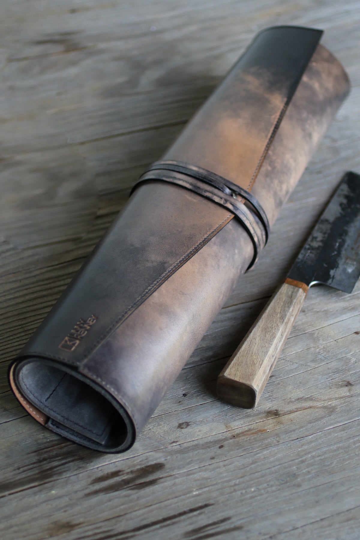 grey and tan leather knife roll
