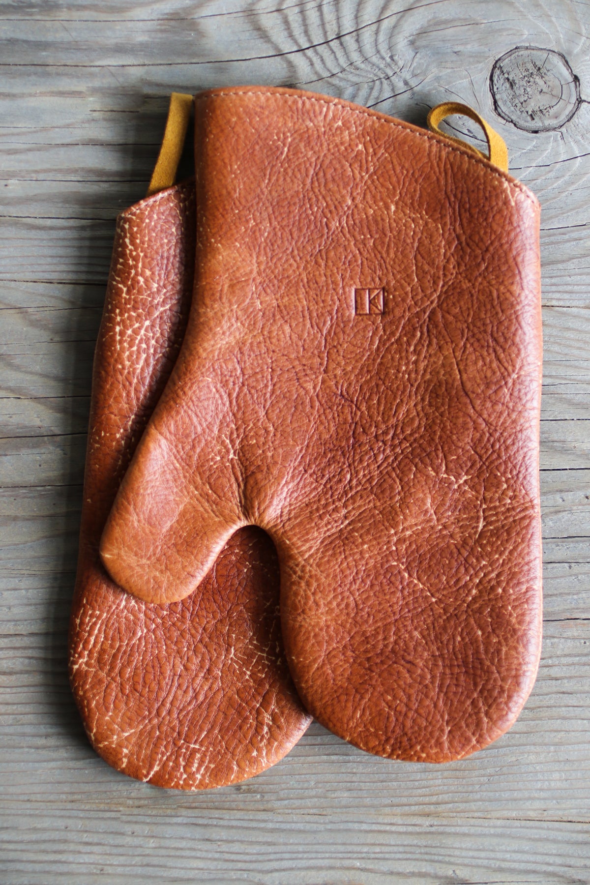 brown leather oven mitts